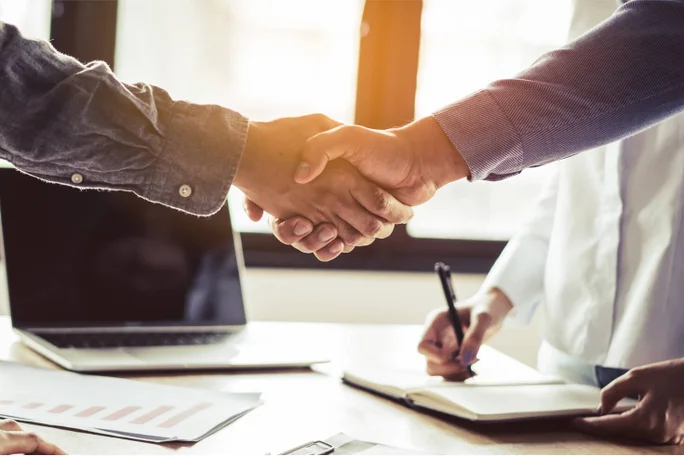 two people shaking hands