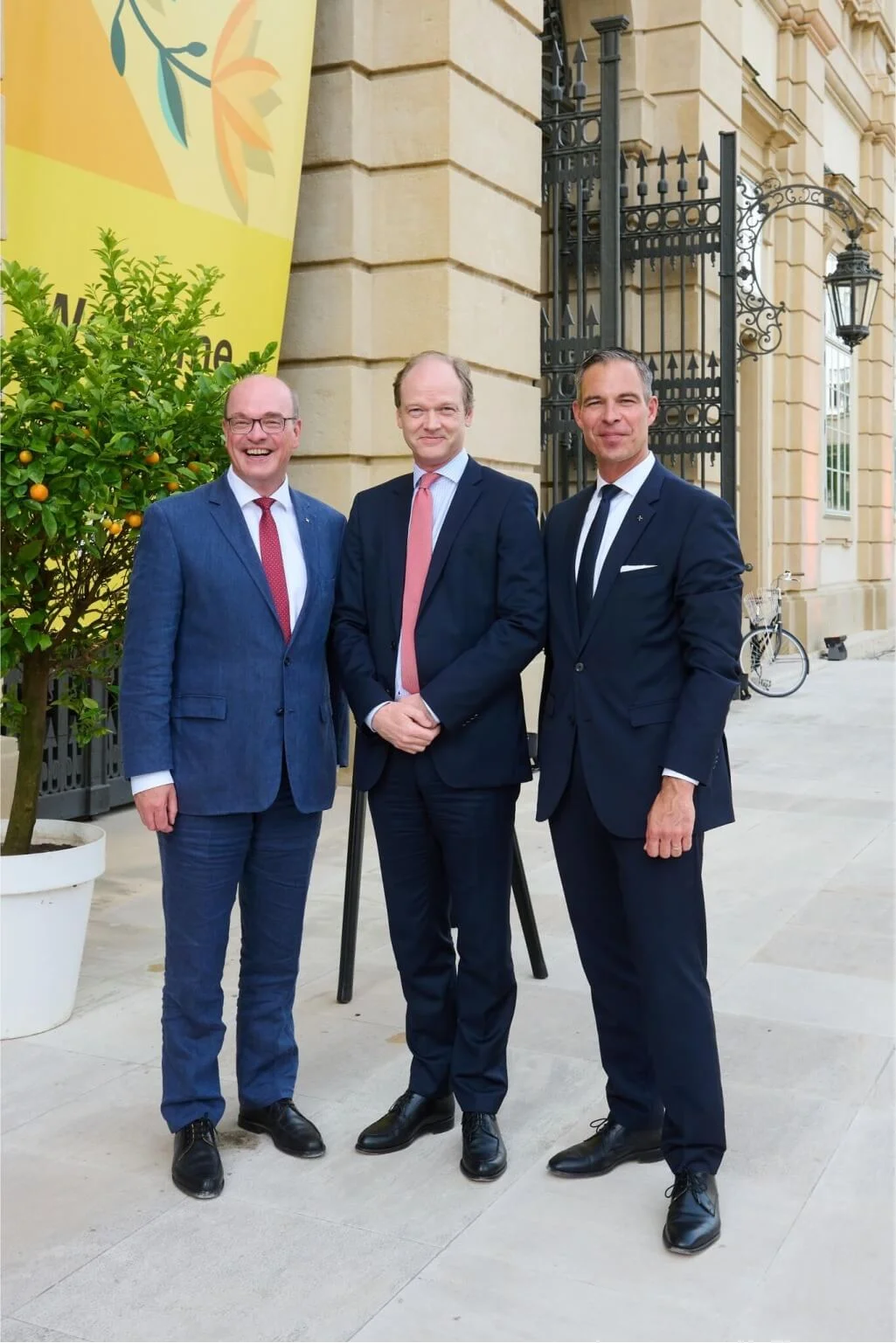 three business men at an event