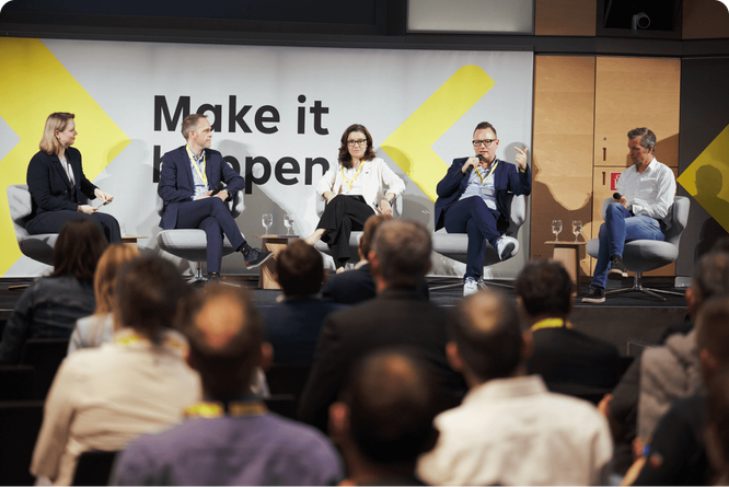 Panel of experts discussing business innovation and strategies, highlighting thought leadership and collaborative dialogue.