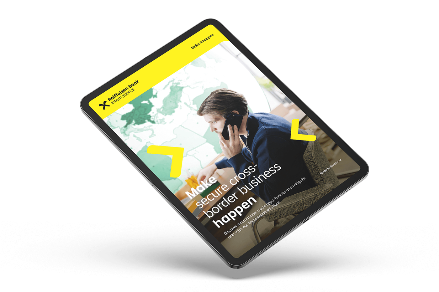 A tablet displaying Raiffeisen Bank International's digital campaign with a person on the phone, a world map in the background, and promotional text.
