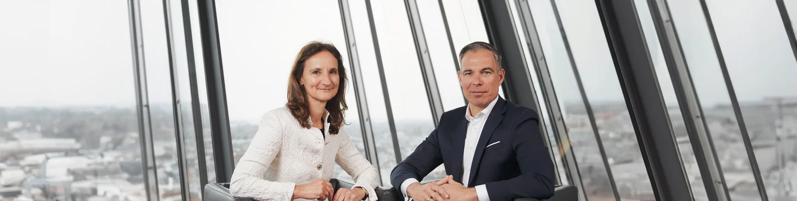 Sabine Zucker and Daniel Rath in office setup