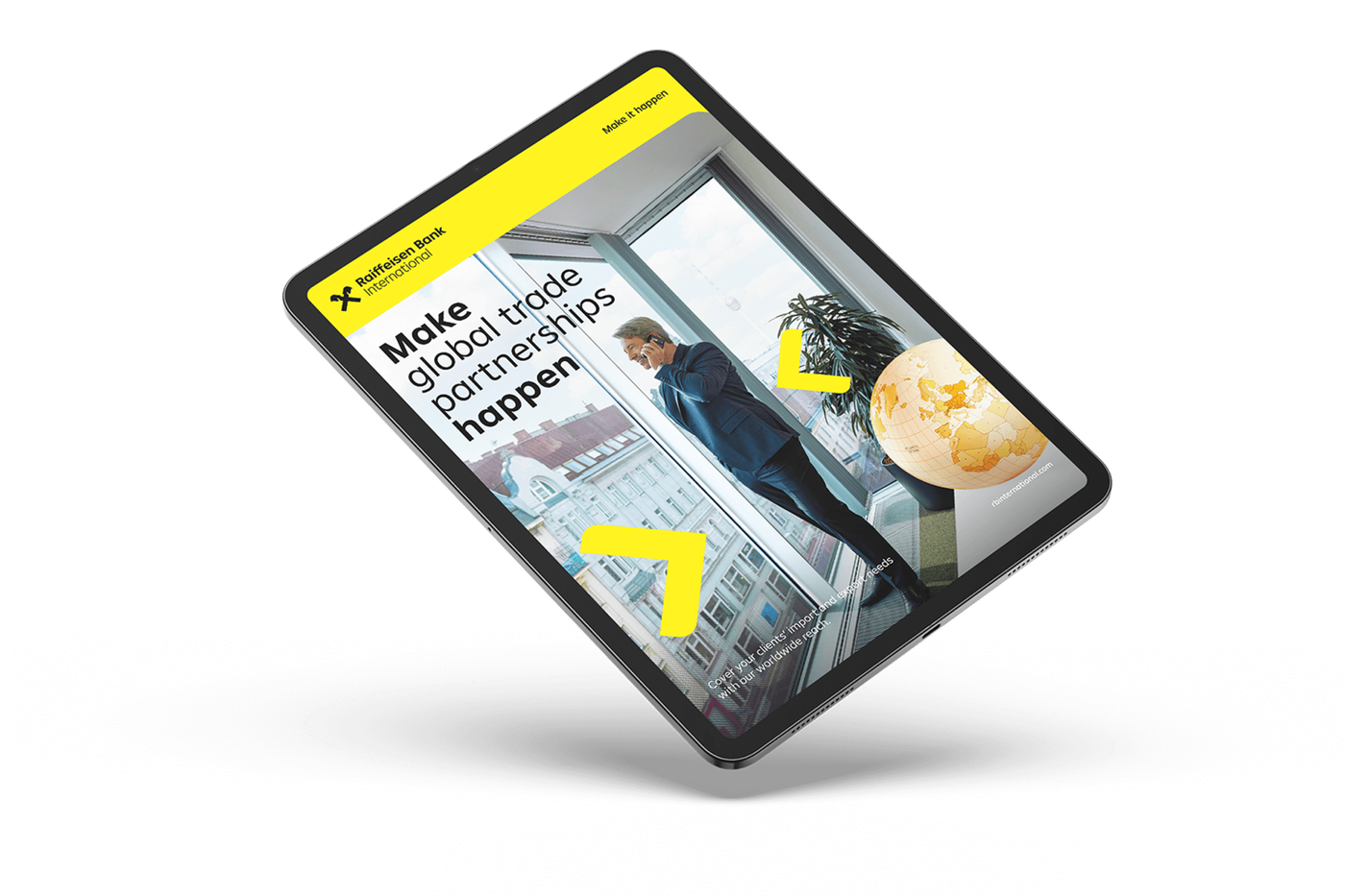A tablet displaying a Raiffeisen Bank International advertisement with a business professional on the phone, a city view, and a globe, promoting global trade partnerships.