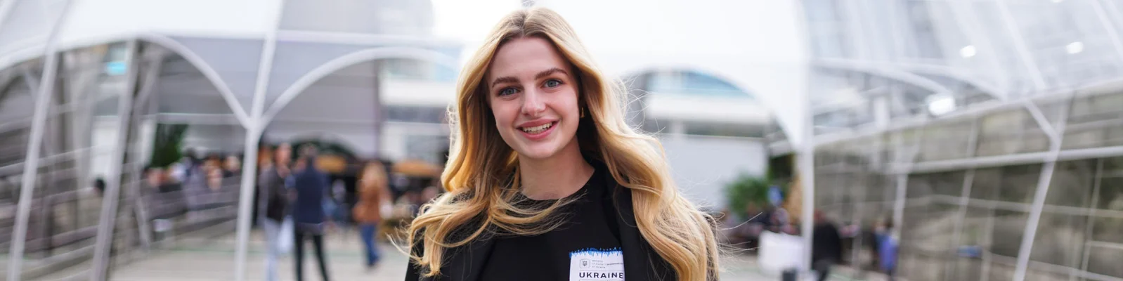 Young woman in front of office building