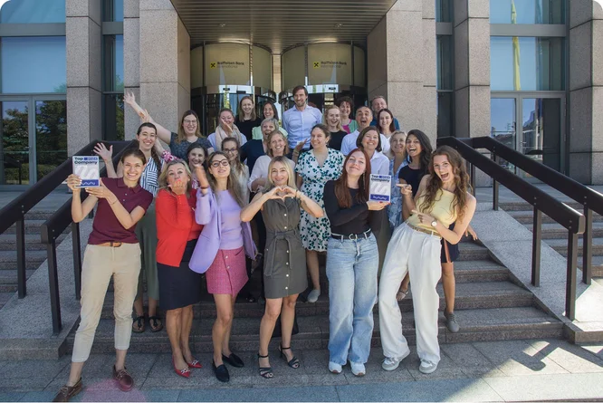 Employees of Raiffeisen Bank International gather to celebrate being recognized as a top-rated company.