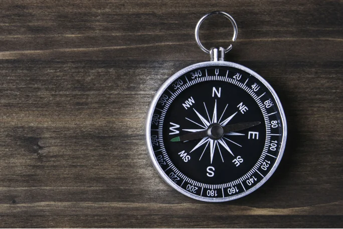 Compass on old desk