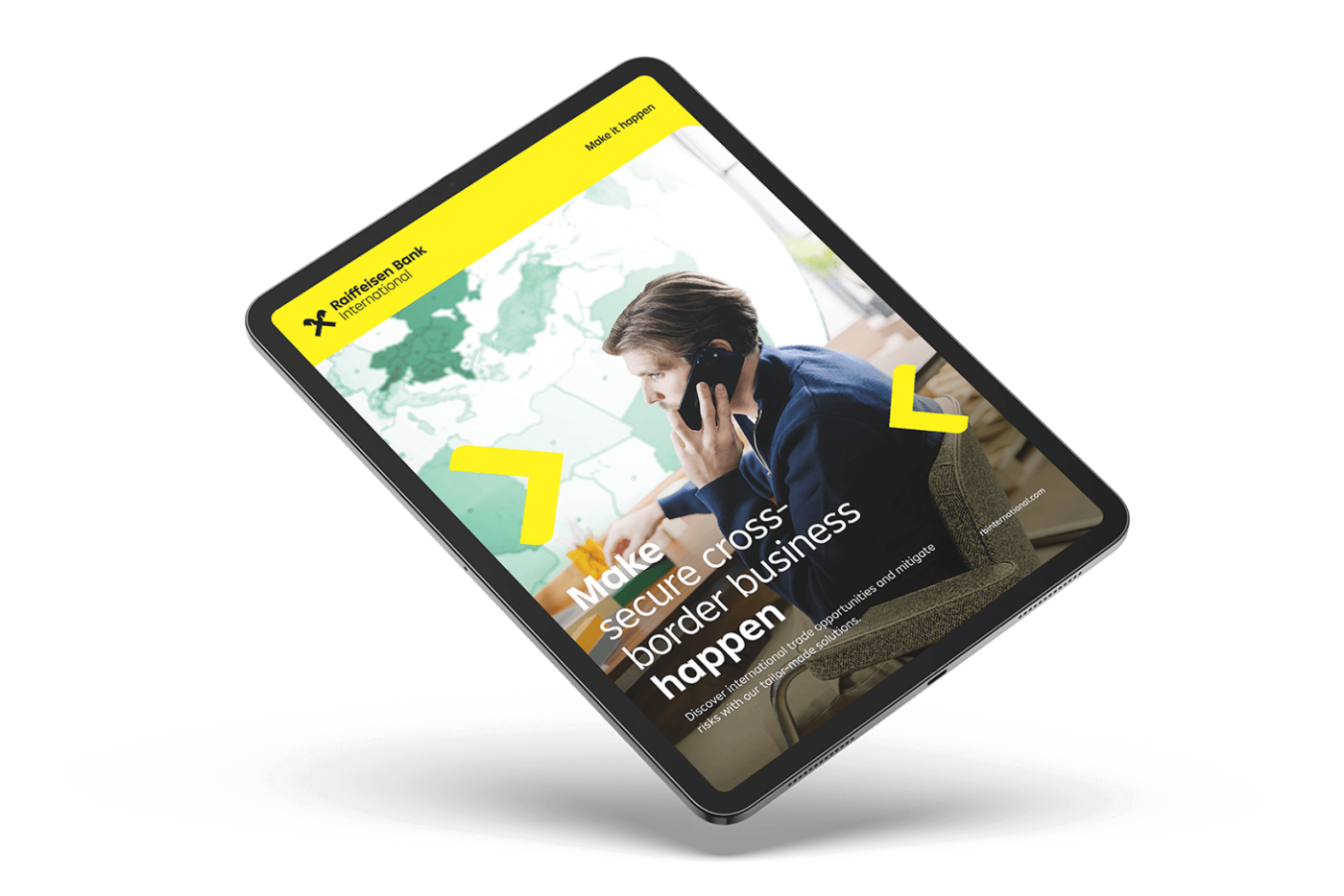 A tablet displaying Raiffeisen Bank International's digital campaign with a person on the phone, a world map in the background, and promotional text.
