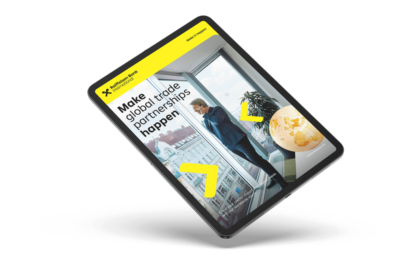 A tablet displaying a Raiffeisen Bank International advertisement with a business professional on the phone, a city view, and a globe, promoting global trade partnerships.