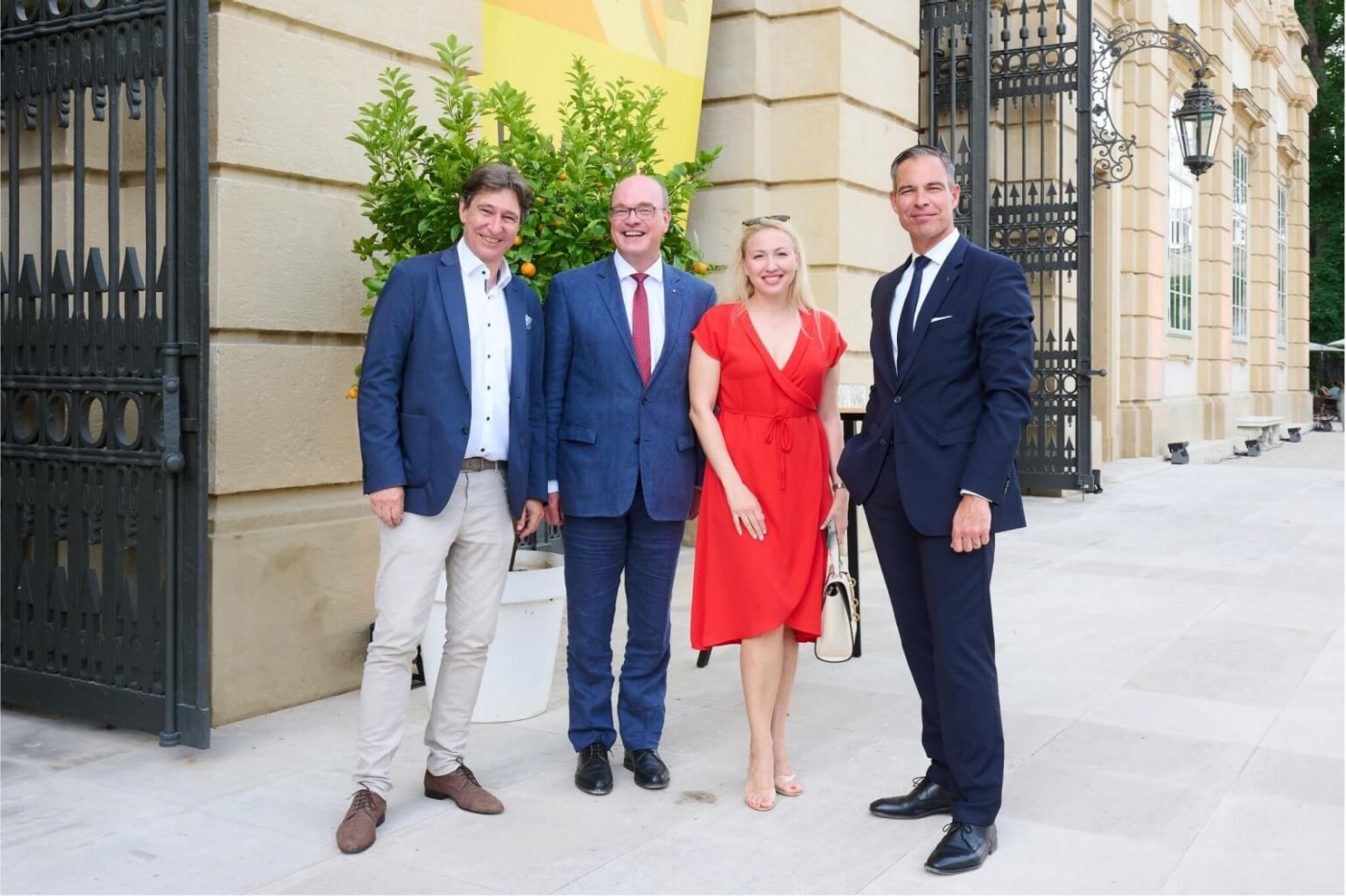 four business people at entrance