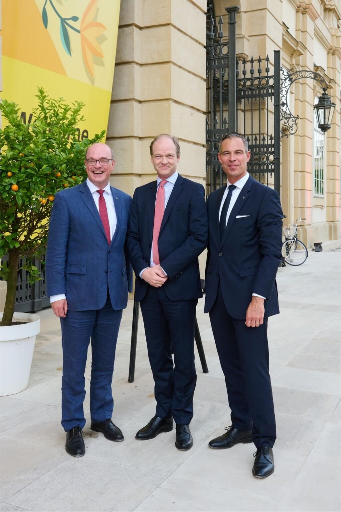 three business men at an event