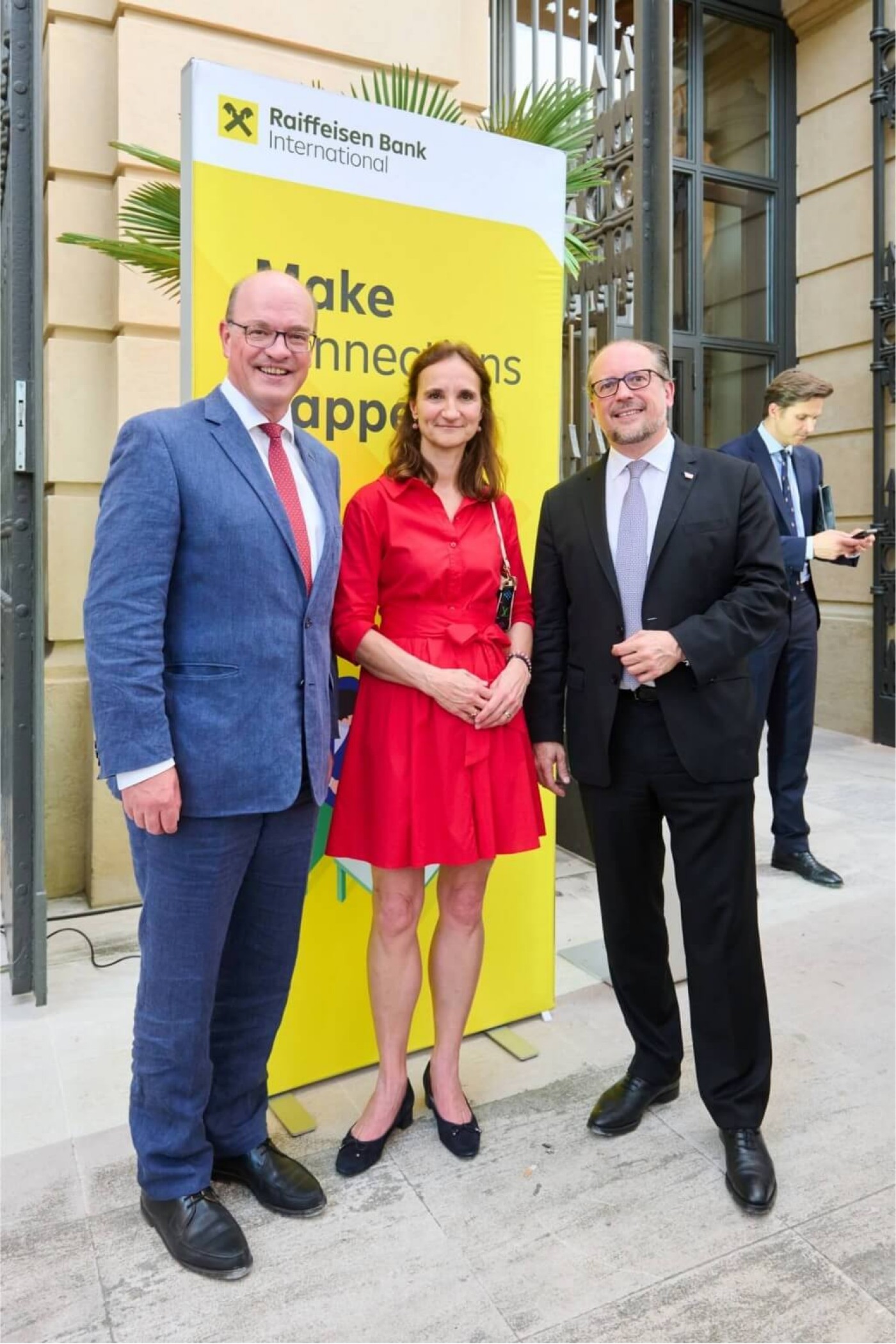 three business people at an event