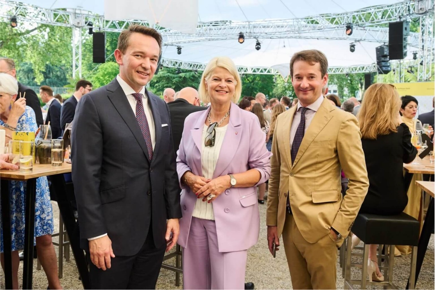 three peolpe at an event