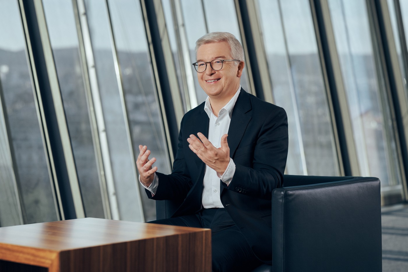 Michael Höllerer, CEO of RBI (white man in a suit)