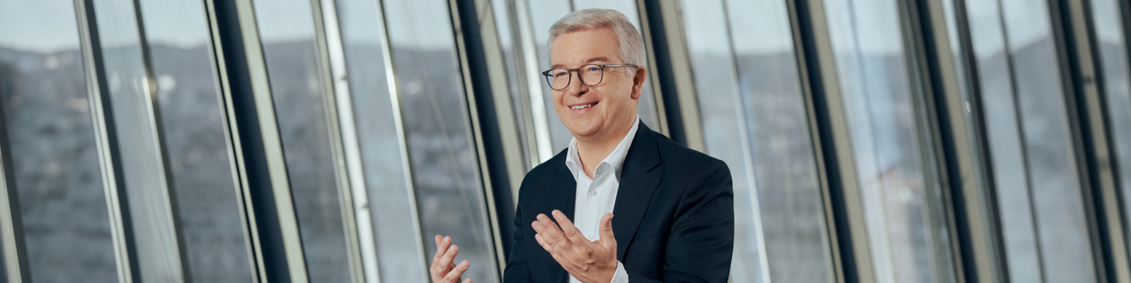 Michael Höllerer, CEO of RBI (white man in a suit)