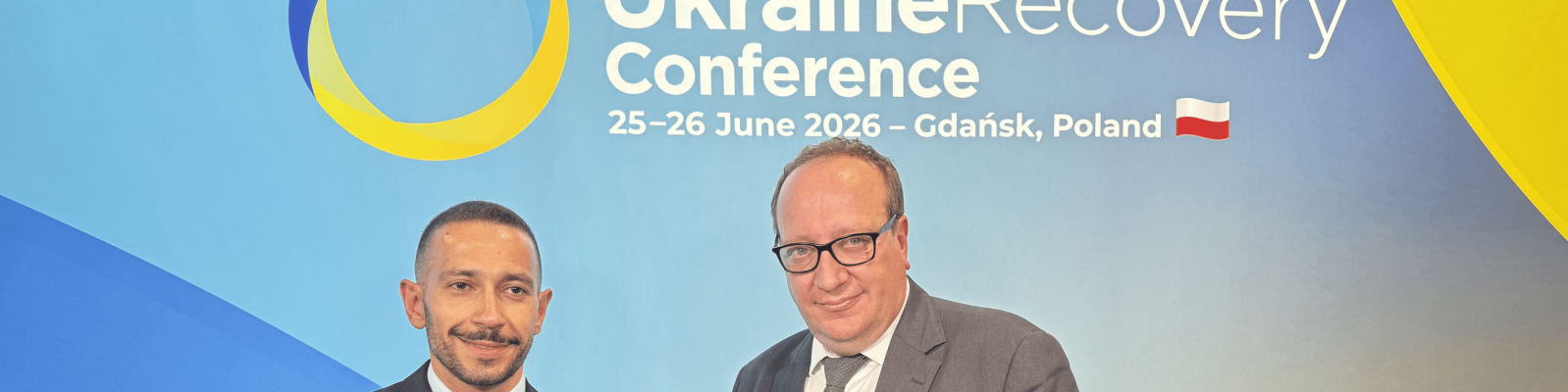 Two men at a conference