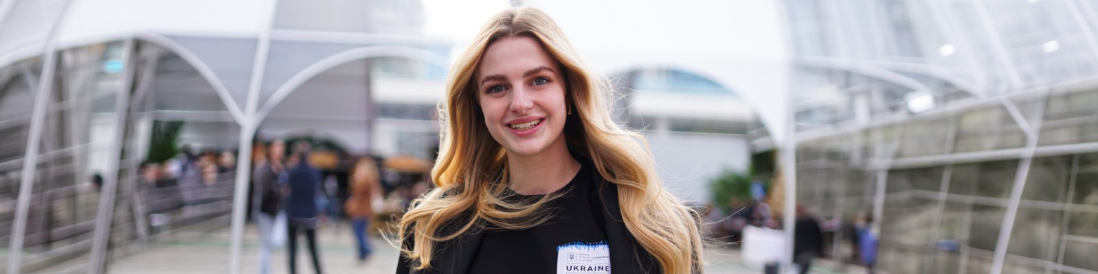 Young woman in front of office building